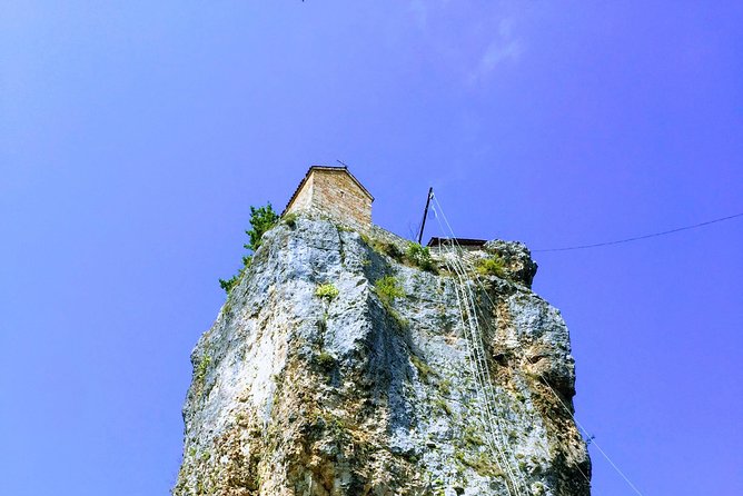Chiatura and Katskhi Pillar One Day Urbex Tour - Mgvimevi Monastery: murals, icons, and a rare wooden door