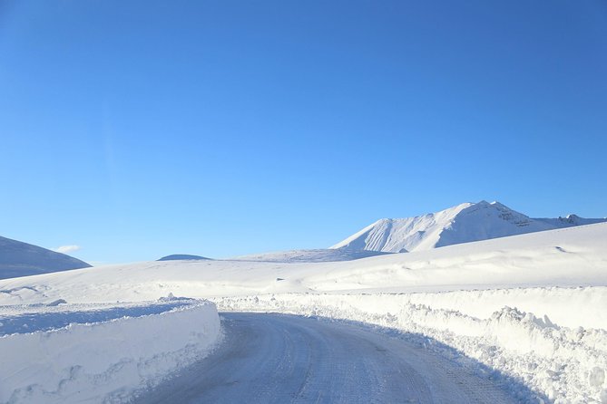 Gudauri Ski Resort day tour from Tbilisi - Zhinvali Reservoir: the dam behind the mountain views