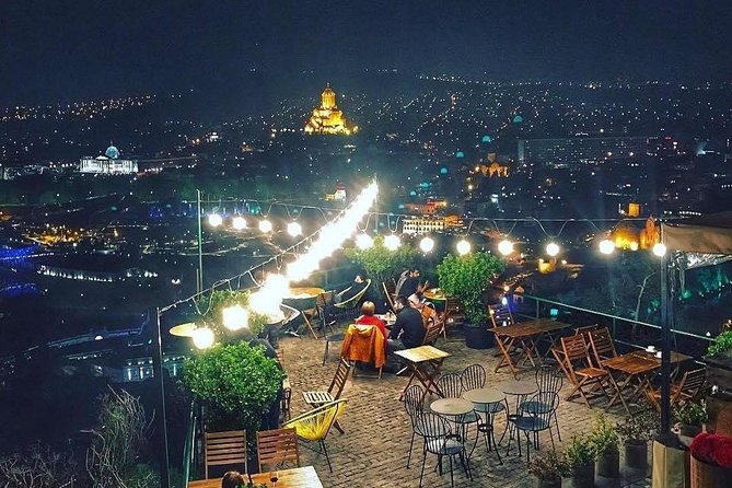 Tbilisi by Night Walking Tour - LED lights over the Kura: Bridge of Peace and Narikala Fortress