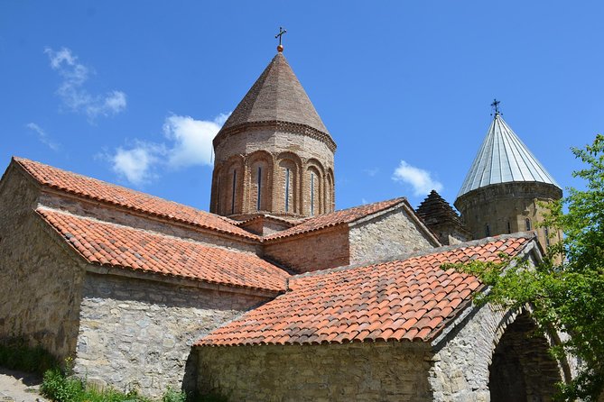 Tour to Kazbegi: Georgian Military Road – Ananuri – Gudaury – Kazbegi - Ananuri Fortress: churches, bas-reliefs, and a prison-well story